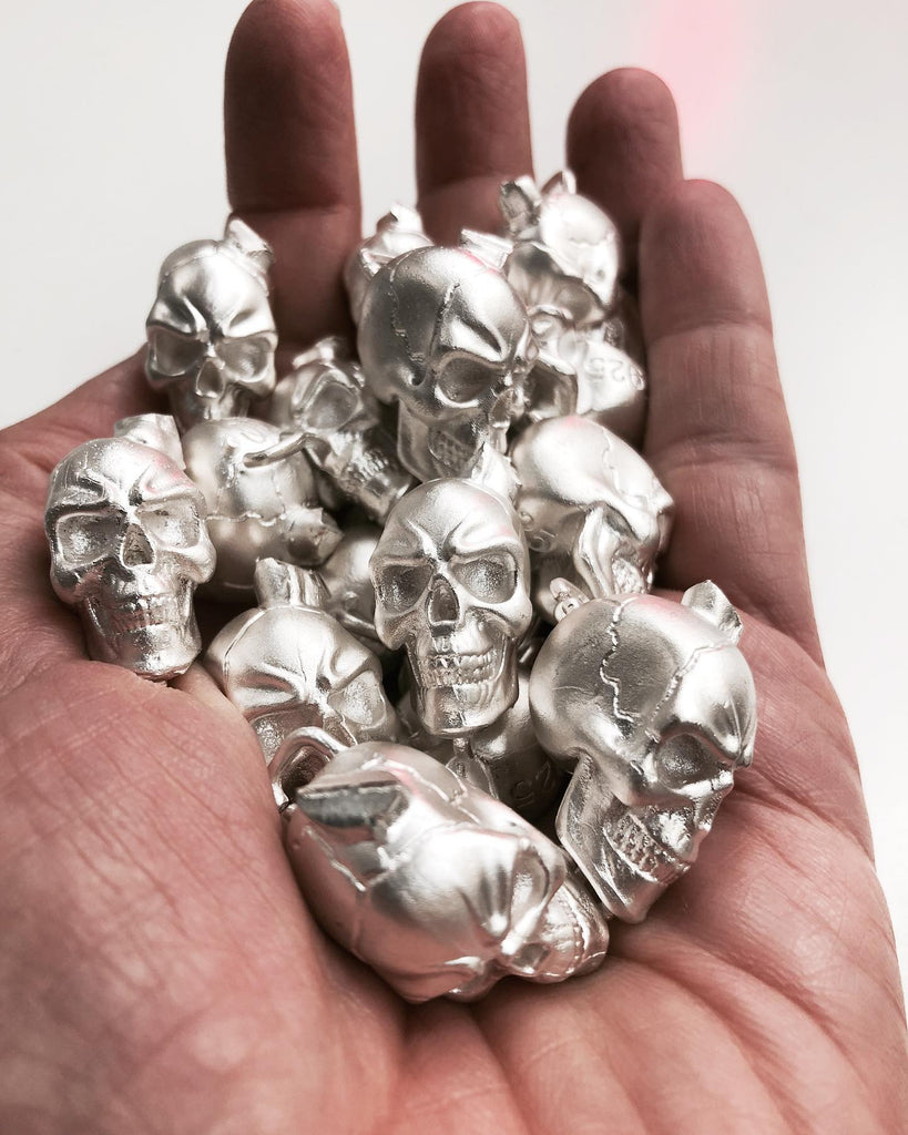 HANDFULL OF SOLID SILVER SKULLS...